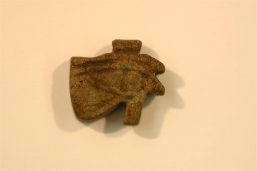 Udjat eye amulet made of lightgreen-brow faience